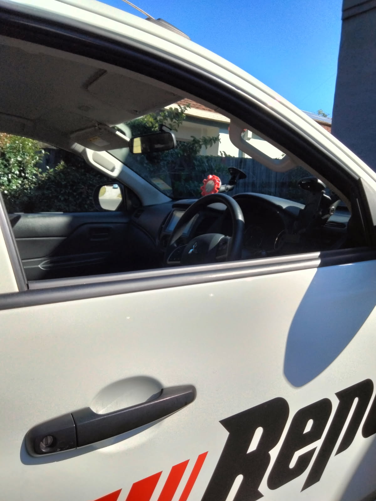 Dnoodle ute phone mount installed on work ute dashboard holding smartphone